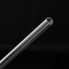 one straight glass straw contrasting with black background