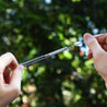 showing how to clean straight glass straw with included brush by strawtopia